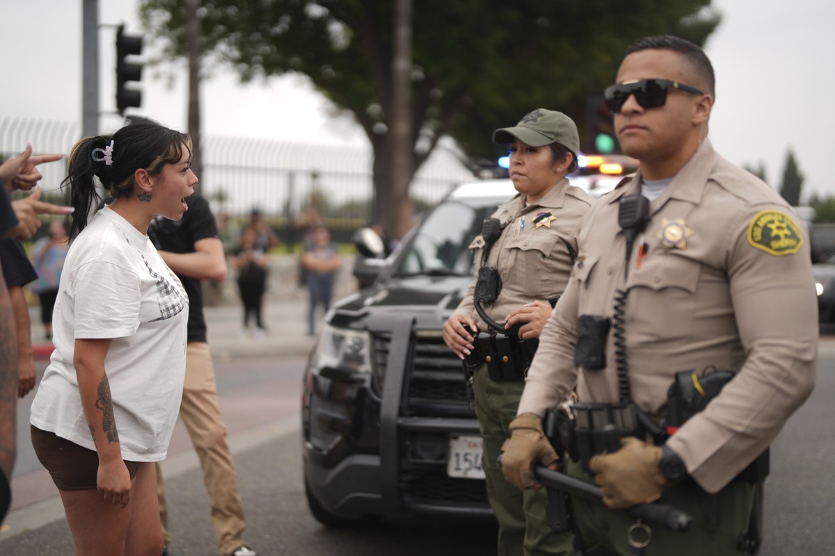 Protesters confront law enforcement agents outside an industrial park in Paramount, Calif., on Saturday, June 7, 2025. (AP Photo/Eric Thayer)