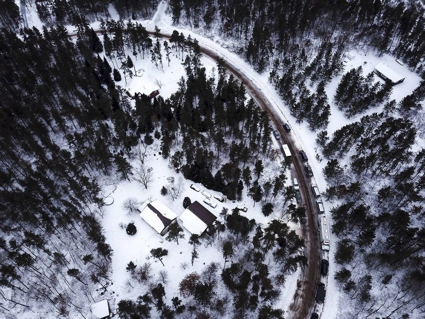 January 12, 2019 - Gordon, WI, USA - The cabin, bottom left, in Gordon, Wis., where Jayme Closs was held for 88 days is surrounded by law enforcement vehicles on Saturday, Jan. 12, 2019. Gordon USA PU ...