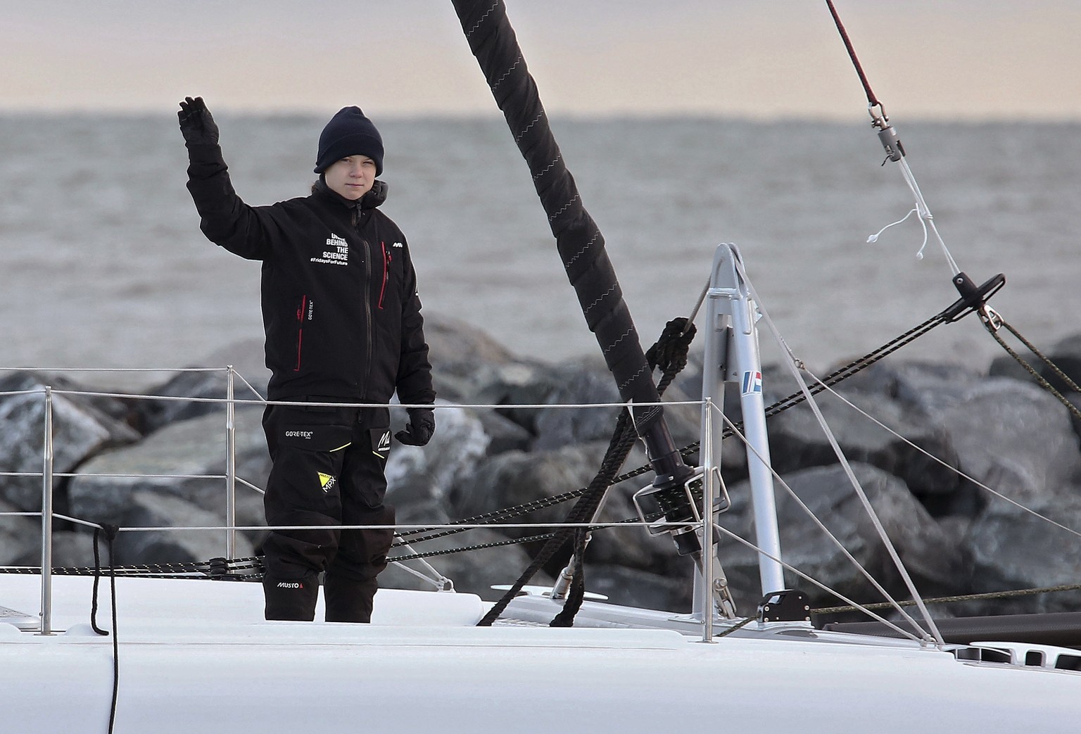 Swedish teen climate activist Greta Thunberg waves from the 48-foot (15-meter) catamaran La Vagabonde as it departs Salt Ponds in Hampton, Va., on Wednesday, Nov. 13, 2019. Thunberg left North America ...