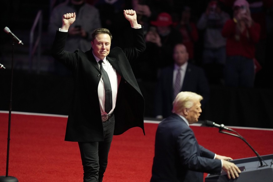 FILE - Elon Musk reacts as President-elect Donald Trump speaks at a rally ahead of the 60th Presidential Inauguration, Jan. 19, 2025, in Washington. (AP Photo/Alex Brandon, File)