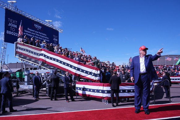 Republican presidential nominee former President Donald Trump gestures as he departs a campaign event at Central Wisconsin Airport, Saturday, Sept. 7, 2024, in Mosinee, Wis. (AP Photo/Alex Brandon)