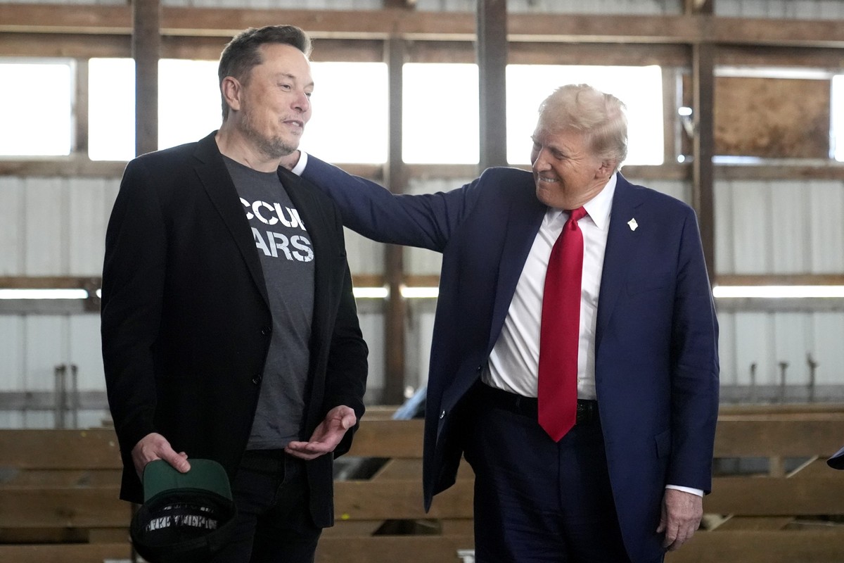FILE - Tesla and SpaceX CEO Elon Musk, left, and Republican presidential nominee former President Donald Trump attend a campaign event at the Butler Farm Show on Oct. 5, 2024, in Butler, Pa. (AP Photo ...
