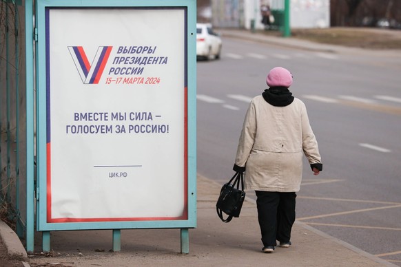 RUSSIA, LUGANSK - MARCH 6, 2024: A poster promoting the 2024 Russian presidential election is pictured in a street. The 2024 Russian presidential election is scheduled for March 15-17, 2024, with the  ...