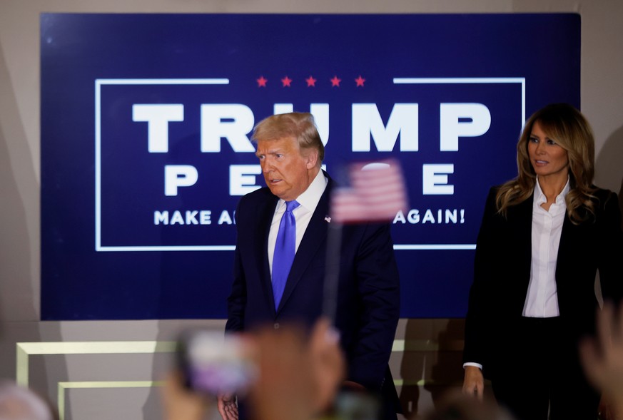 U.S. President Donald Trump accompanied by first lady Melania Trump arrives to speak about early results from the 2020 U.S. presidential election in the East Room of the White House in Washington, U.S ...