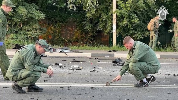 Russia Political Philosopher Daughter Murder 8256846 21.08.2022 In this handout video grab released by the Russian Investigative Committee, investigators work at the site of a car blast which killed j ...