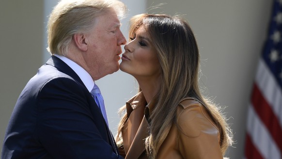 President Donald Trump kisses first lady Melania Trump following an event where Melania Trump announced her initiatives in the Rose Garden of the White House in Washington, Monday, May 7, 2018. The fi ...