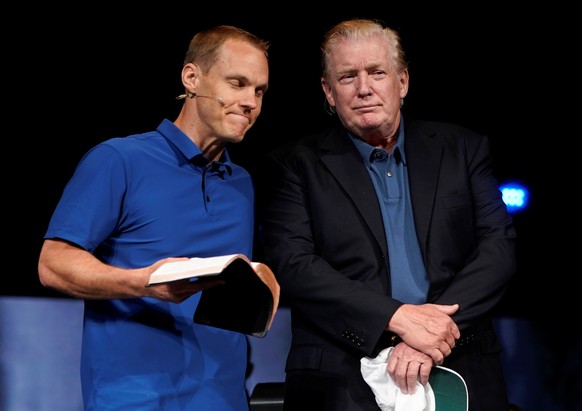 U.S. President Donald Trump stands on stage as Pastor David Platt prays for him at the McLean Bible Church, in Vienna, Virginia, U.S., June 2, 2019. REUTERS/Joshua Roberts