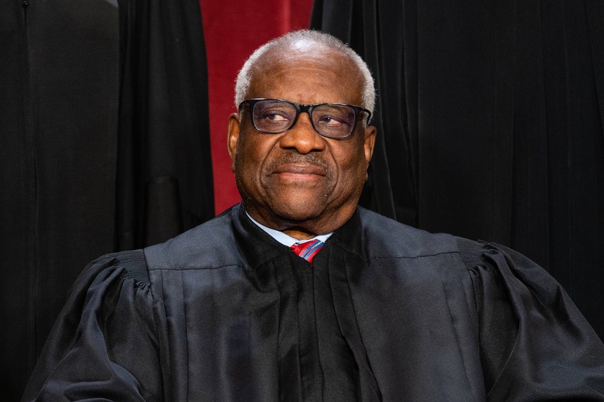 Associate Justice Clarence Thomas is shown during the formal group photograph at the Supreme Court in Washington, DC, US, on Friday, Oct. 7, 2022. The court opened its new term Monday with a calendar  ...
