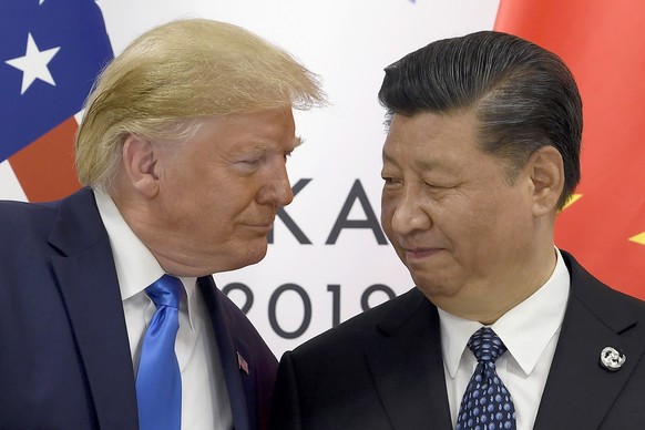 FILE - In this Saturday, June 29, 2019, file photo, U.S. President Donald Trump, left, meets with Chinese President Xi Jinping during a meeting on the sidelines of the G-20 summit in Osaka, Japan.(AP  ...