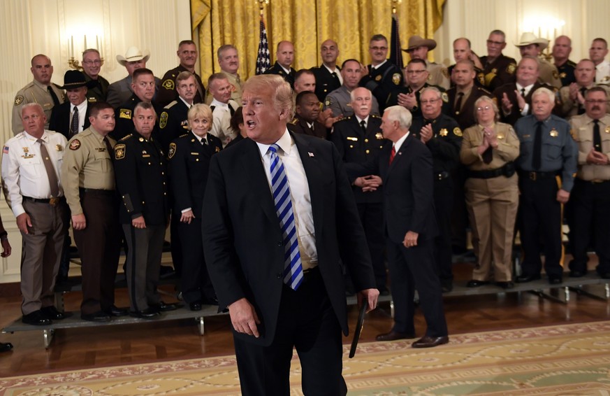 President Donald Trump responds to a reporters question during an event with sheriffs in the East Room of the White House in Washington, Wednesday, Sept. 5, 2018. (AP Photo/Susan Walsh)