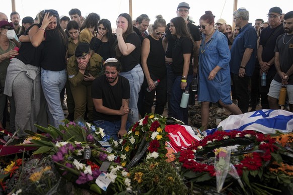 Mourners attend the funeral of the Kotz family in Gan Yavne, Israel, Tuesday, Oct. 17, 2023. The Israeli family of five was killed by Hamas militants on Oct. 7 at their house in Kibbutz Kfar Azza near ...