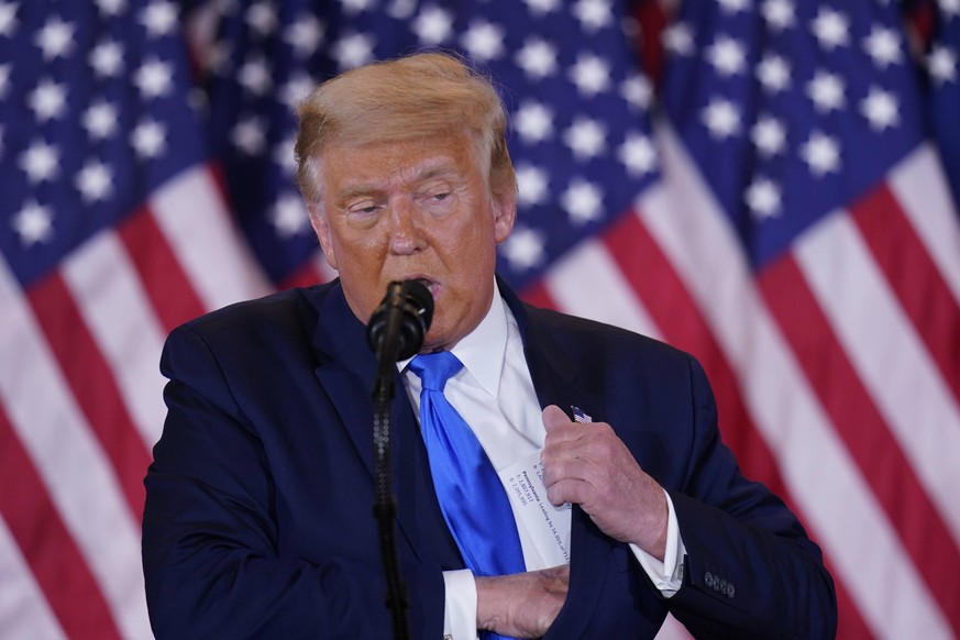 United States President Donald J. Trump makes a statement to the nation as his supporters look on in the East Room of the White House in Washington, DC on Election Night, Wednesday, November 4, 2020.  ...