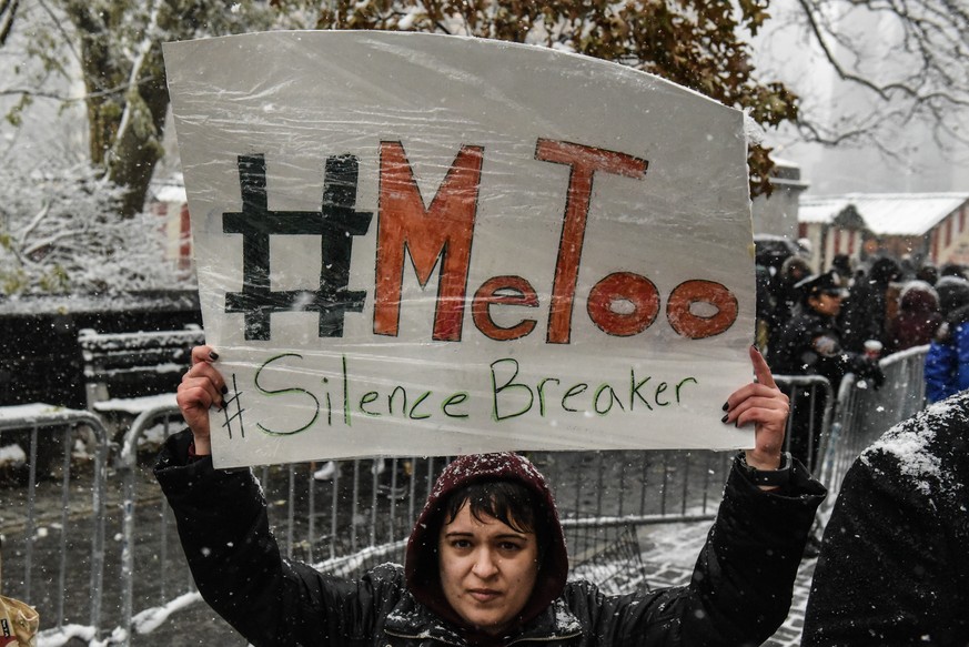 NEW YORK, NY - DECEMBER 09: People carry signs addressing the issue of sexual harassment at a #MeToo rally outside of Trump International Hotel on December 9, 2017 in New York City. (Photo by Stephani ...