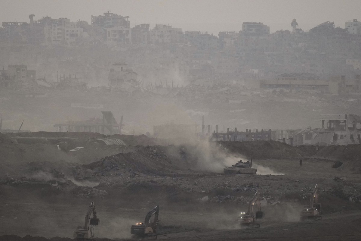 An Israeli army tank advances in the Gaza Strip, as seen from southern Israel on Thursday, July 3, 2025. (AP Photo/Leo Correa)