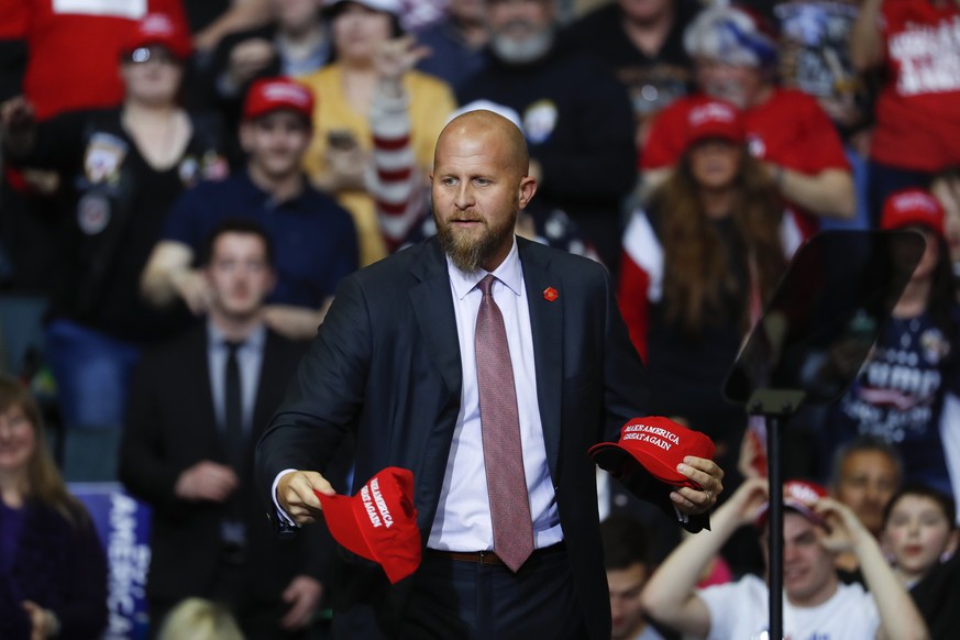 FILE - In this Thursday, March 28, 2019, file photo, Brad Parscale, manager of President Donald Trump's reelection campaign, throws &quot;Make America Great Again,&quot; hats to the audience before a  ...
