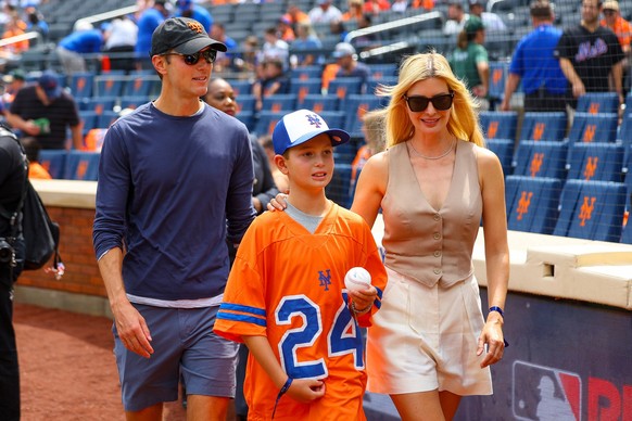 Miami Marlins v New York Mets Ivanka Trump and Jared Kushner are standing on the field with one of their children prior to the start of the baseball game against the Miami Marlins at Citi Field in Cor ...