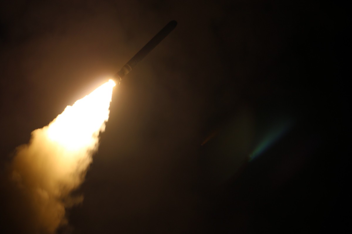FILE - In this image provided by the U.S. Navy, the guided-missile destroyer USS Laboon (DDG 58) fires a Tomahawk land attack missile on April 14, 2018, as part of the military response to Syria&#039; ...