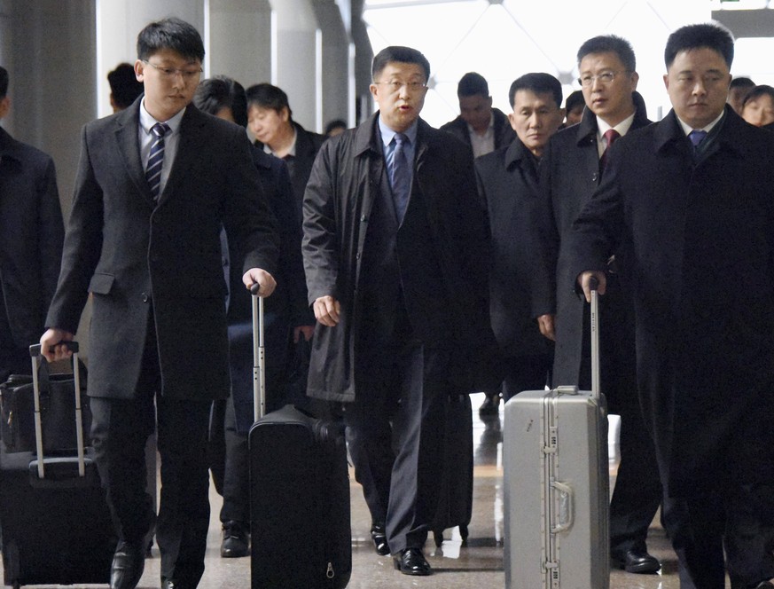 N. Korea s negotiator with U.S. Kim Hyok Chol (C), North Korea s interlocutor leading negotiations with the Untied States, arrives at Beijing s international airport on Feb. 19, 2019, on his way to th ...