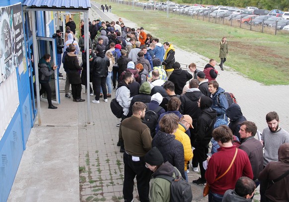 URALSK, KAZAKHSTAN SEPTEMBER 28, 2022: People wait in line outside a public service centre. According to the Kazakh Interior Ministry, around 98 thousand Russian citizens have arrived in Kazakhstan si ...