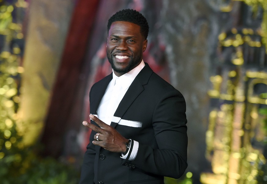 FILE - In this Dec. 11, 2017 file photo, Kevin Hart arrives at the Los Angeles premiere of &quot;Jumanji: Welcome to the Jungle&quot; in Los Angeles. Hart will host the 2019 Academy Awards, fulfilling ...