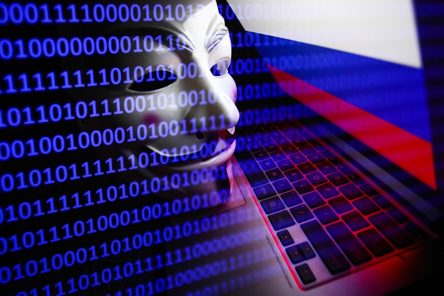 Russian flag displayed on a laptop screen, Guy Fawkes mask and binary code displayed on a screen are seen in this multiple exposure illustration photo taken in Krakow, Poland on March 1, 2022. Global  ...