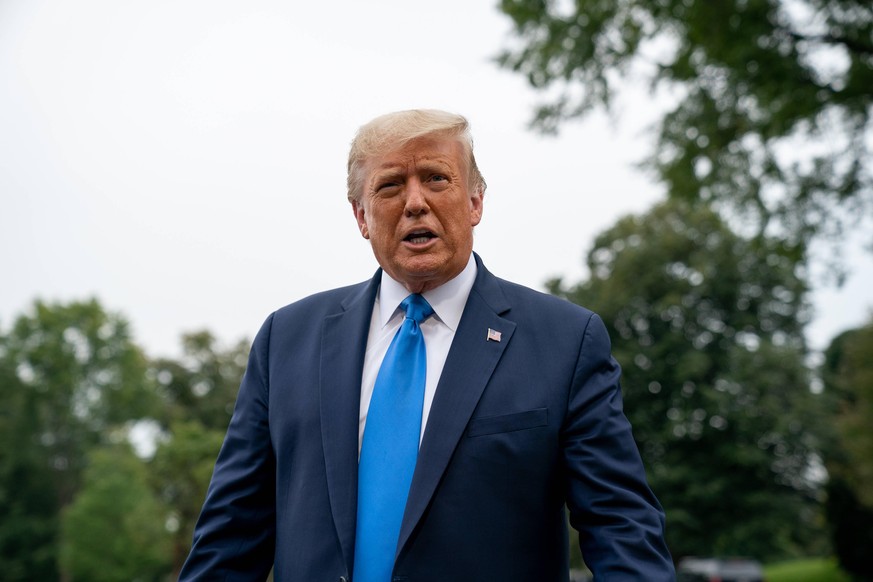United States President Donald J. Trump speaks to members of the media on the South Lawn of the White House before boarding Marine One in Washington, D.C., U.S., on Thursday, September 24, 2020. Photo ...