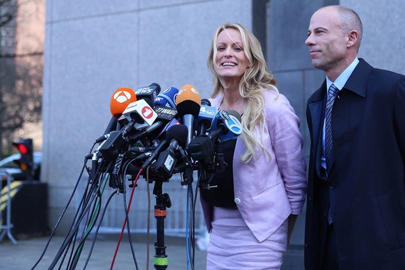 January 27, 2022, Manhattan, NY, USA: Stephanie Clifford, known as Stormy Daniels in the adult film industry, is interviewed alongside her former lawyer Michael Avenatti as she leaves Manhattan Federa ...
