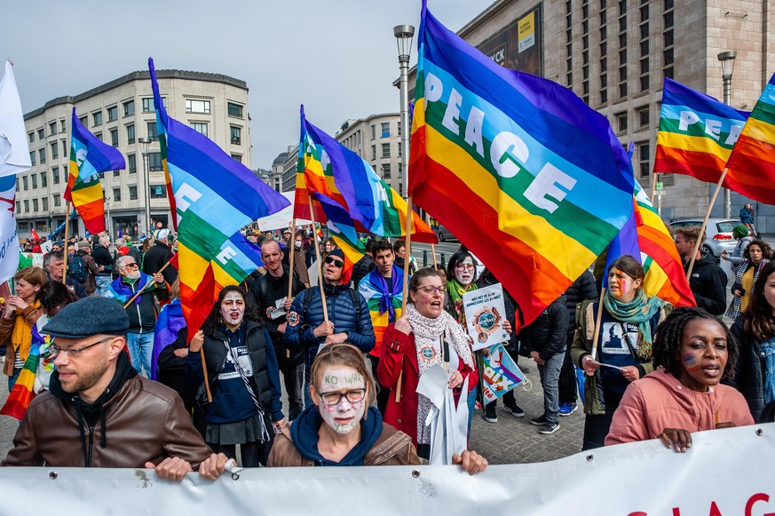 People are holding rainbow flags with the word peace on them, during the National peace rally organized in Brussels, on March 27th, 2022. (Photo by Romy Arroyo Fernandez/NurPhoto)