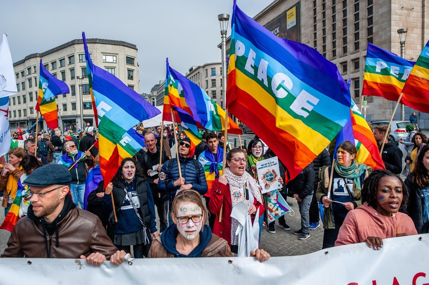 People are holding rainbow flags with the word peace on them, during the National peace rally organized in Brussels, on March 27th, 2022. (Photo by Romy Arroyo Fernandez/NurPhoto)