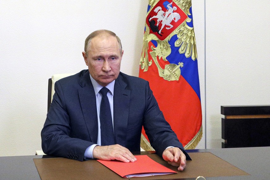 Russian President Vladimir Putin chairs a Security Council meeting via videoconference at the Novo-Ogaryovo residence outside Moscow, Russia, Friday, Aug. 12, 2022. (Mikhail Klimentyev, Sputnik, Kreml ...