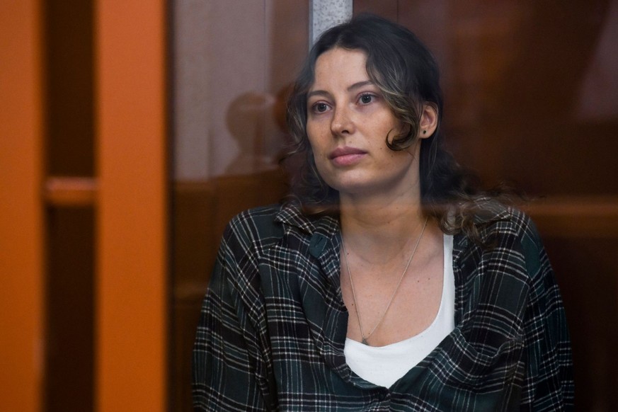 FILE - Ksenia Karelina, also known by the last name of Khavana, sits in a defendant&#039;s cage in a court in Yekaterinburg, Russia, on Thursday, June 20, 2024. (AP Photo, File)