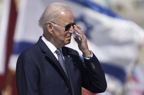 President Joe Biden adjusts his glasses during a welcoming ceremony upon his arrival at Ben Gurion International Airport near Tel Aviv, Israel Wednesday, July 13, 2022. Biden arrives in Israel on Wedn ...