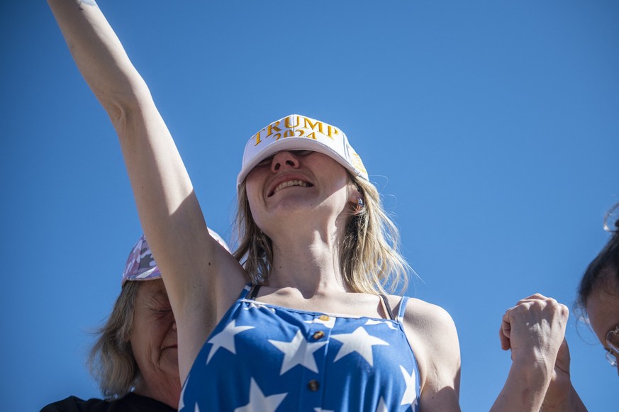 Women pray around and hold up Felecia Hicks at the Take Back Our Border Convoy rally at Cornerstone Children&#039;s Ranch on February 3, 2024 near Quemado, Texas. In trucks, vans and RVs, hundreds of  ...