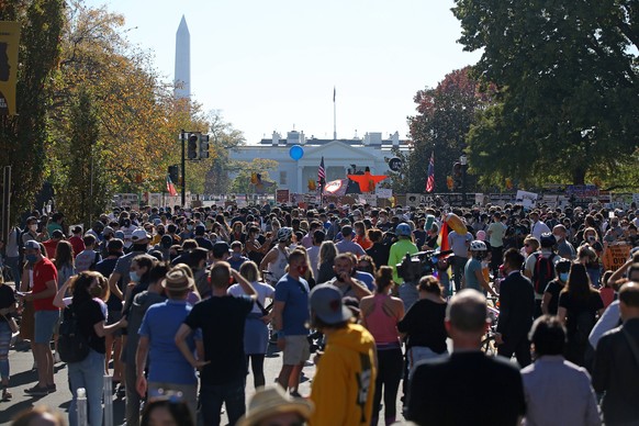 WASHINGTON, D.C., USA - NOVEMBER 7, 2020: Citizens gather in a street near the White House after the media announcement that Democratic Party nominee Joe Biden has won the 2020 US presidential electio ...
