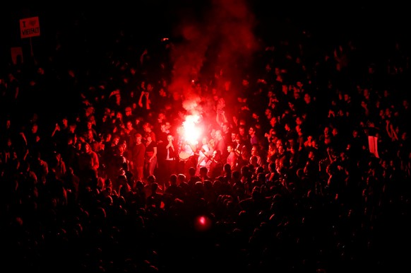 People with flares react during an open air &quot;anti-racism concert&quot; in Chemnitz, Germany, September 3, 2018. REUTERS/Hannibal Hanschke