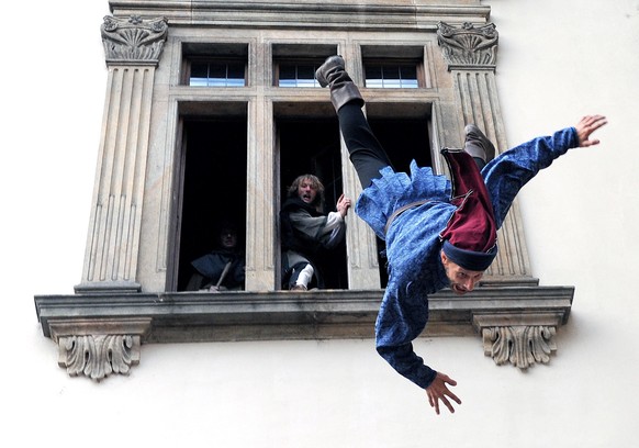 An actor wearing a traditional costume is thrown out of a window during a performance to celebrate the anniversary of the First Defenestration of Prague, in Prague, Czech Republic, 31 July 2009. The D ...