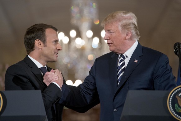 President Donald Trump and French President Emmanuel Macron shake hands during a joint news conference in the East Room of the White House in Washington, Tuesday, April 24, 2018. (AP Photo/Andrew Harn ...