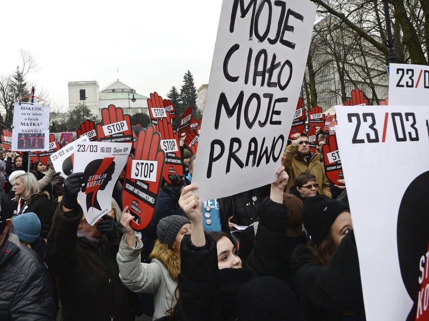 A protester raises a placard reading &quot;My Body My Choice&quot; during a demonstration against efforts by the nation&#039;s conservative leaders to tighten Poland&#039;s already restrictive abortio ...