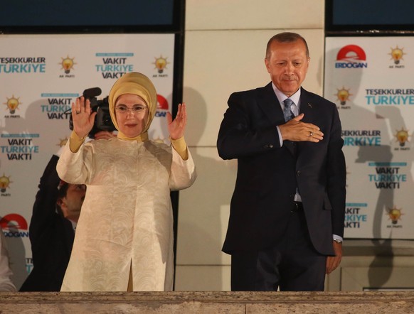 ANKARA, TURKEY - JUNE 25: Turkey's President Recep Tayyip Erdogan and his wife Emine Erdogan greet supporters gathered in front of the AK Party headquarters on June 25, 2018 in Ankara, Turkey. More th ...