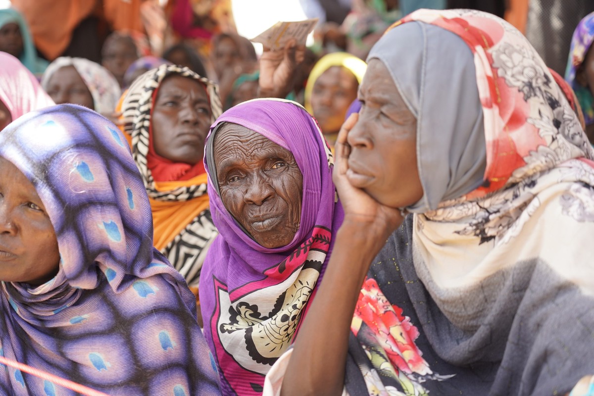 This September 2022 photo provided by the World Food Program shows internally displaced people at the ZamZam camp in El Fasher, North Darfur state, Sudan. (Leni Kinzli/WFP via AP)