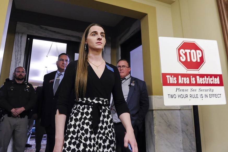 Rep. Zooey Zephyr, D-Missoula, walks out of the Montana House of Representatives after lawmakers voted to ban her from the chamber on Wednesday, April 26, 2023, in the State Capitol in Helena, Montana ...