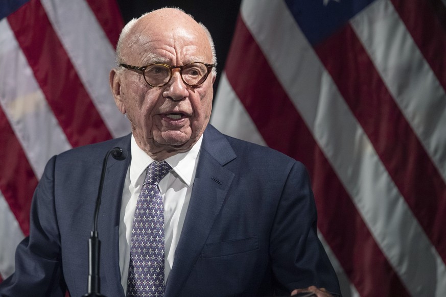 FILE - Rupert Murdoch introduces Secretary of State Mike Pompeo during the Herman Kahn Award Gala, Oct. 30, 2019, in New York. Murdoch, chairman of Fox Corp., acknowledged in a deposition that some Fo ...