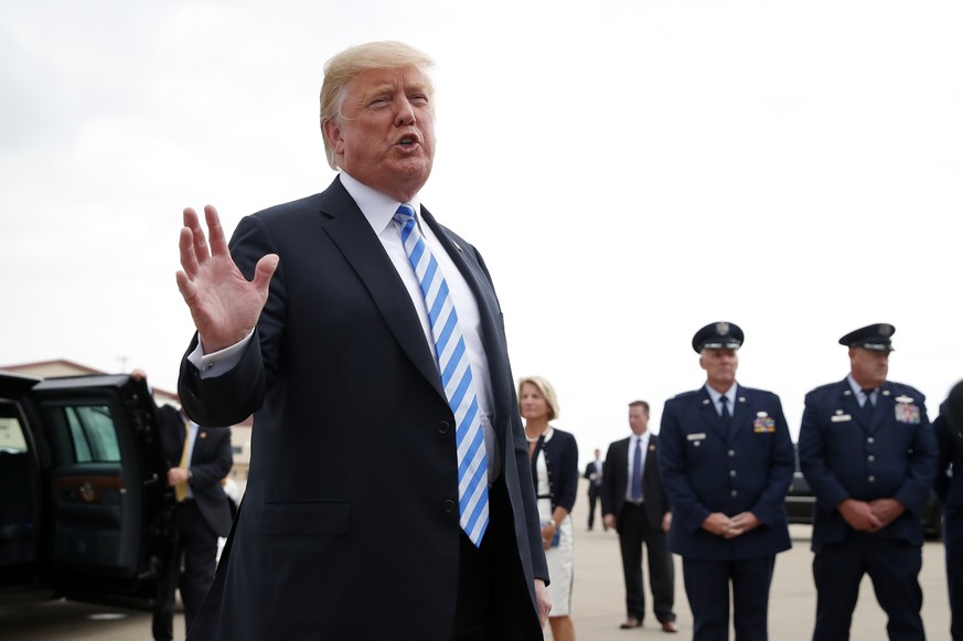 President Donald Trump speaks to the media after he steps off Air Force One, Tuesday, Aug. 21, 2018, in Charleston, W.Va. Trump says the conviction of his former campaign chairman Paul Manafort on fin ...