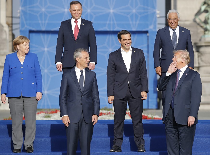 President Donald Trump, lower right, leans back to talk to from left, German Chancellor Angela Merkel, Polish President Andrzeji Duda, NATO Secretary General Jens Stoltenberg, Greek Prime Minister Ale ...