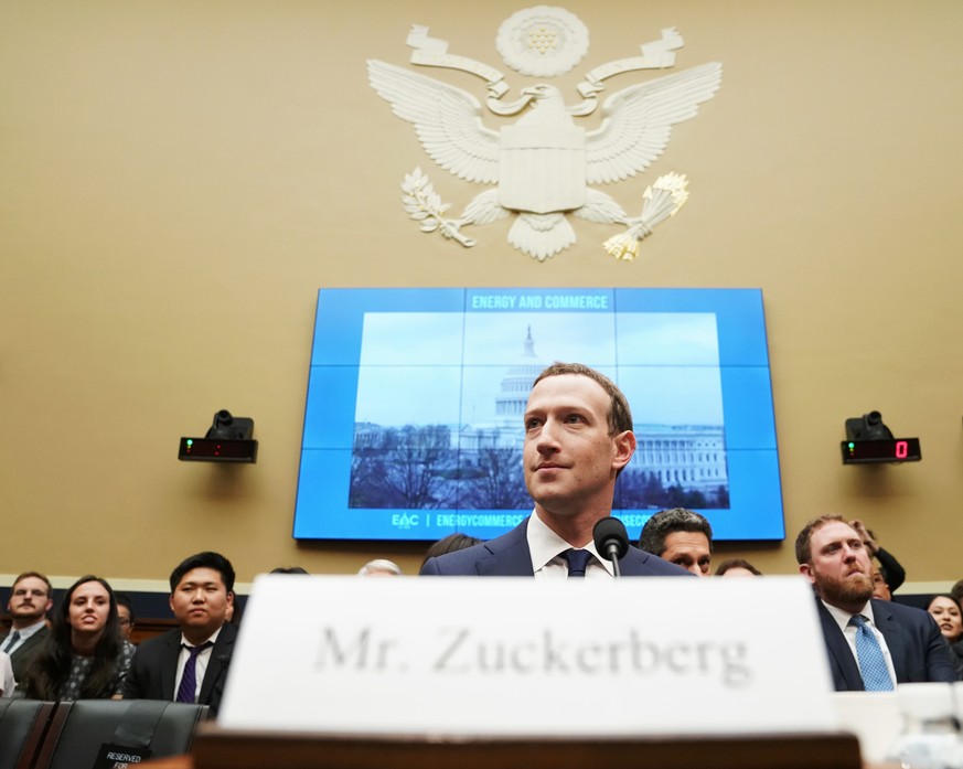 Facebook CEO Mark Zuckerberg arrives to testify before a House Energy and Commerce hearing on Capitol Hill in Washington, Wednesday, April 11, 2018, about the use of Facebook data to target American v ...