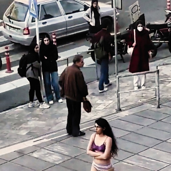 Iranian Woman Detained After Taking Clothes Off At University - Tehran The protest of a Iranian female student of Tehran University of Research Sciences stripping off down to her underwear to protest  ...