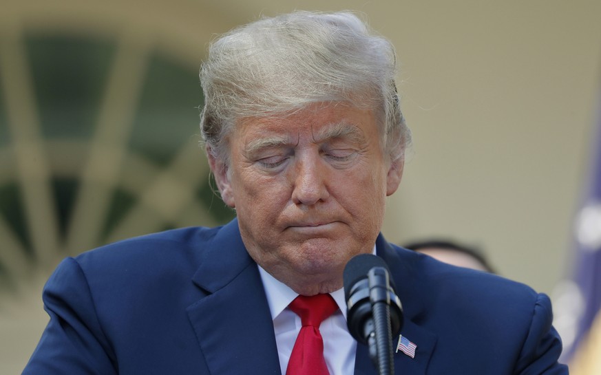 President Donald Trump pauses while he takes questions on a revamped North American free trade deal, in the Rose Garden of the White House in Washington, Monday, Oct. 1, 2018. The new deal, reached ju ...