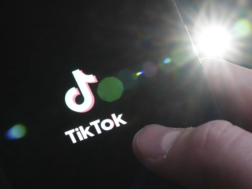 The TikTok startup page is displayed on an iPhone in Ottawa, Ontario, Monday, Feb. 27, 2023. The federal government is banning TikTok from its mobile devices just days after federal and provincial pri ...