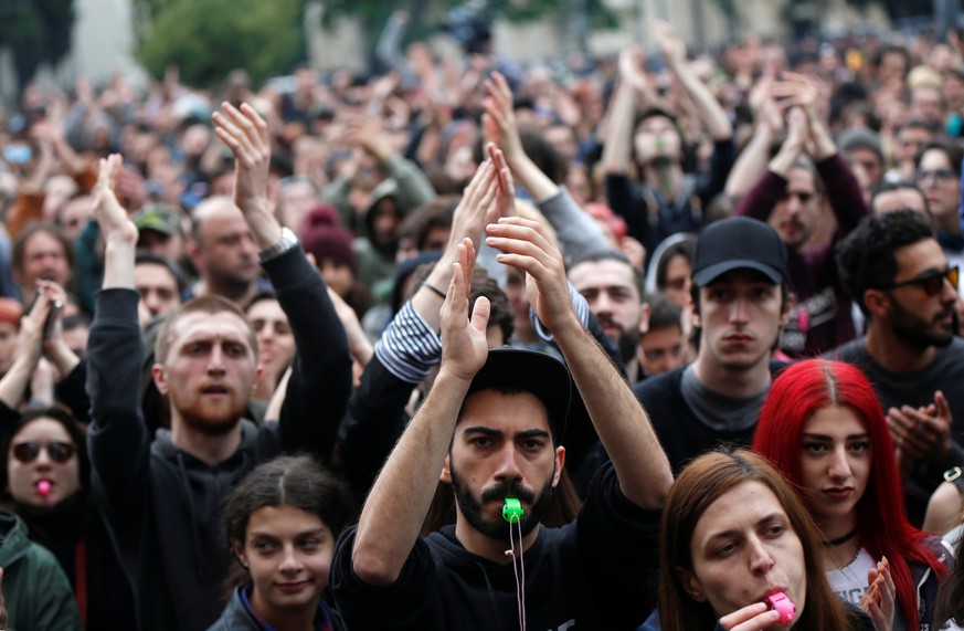 Protesters attend a rally against the Georgian authorities&#039; anti-drug policy following the recent police raids at several local nightclubs near the building of parliament in Tbilisi, Georgia May  ...