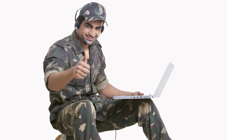 Young soldier using laptop and showing thumbs up sign PUBLICATIONxNOTxINxIND

Young Soldier Using Laptop and showing Thumbs up Sign